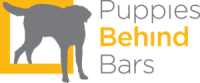 Puppies behind bars